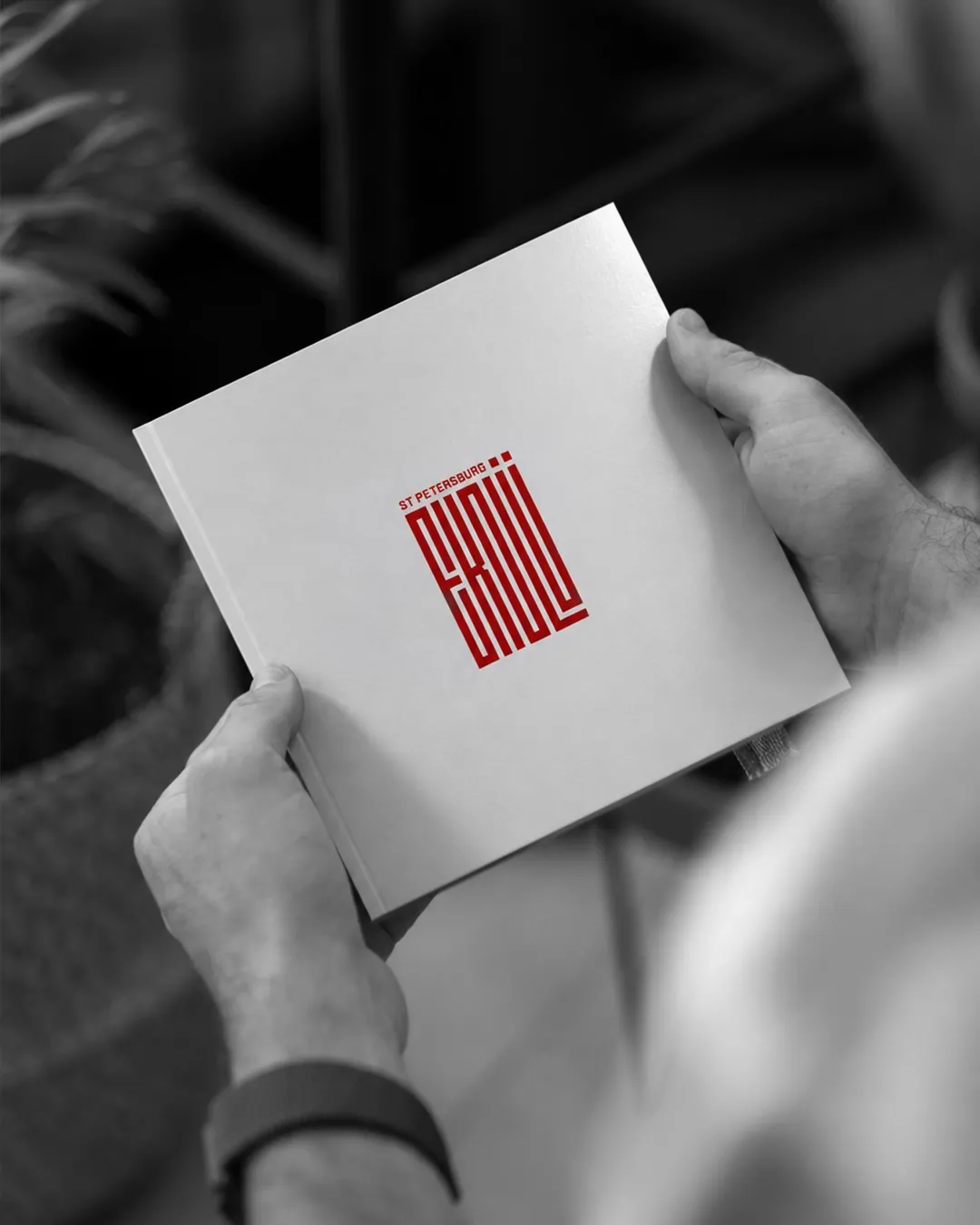 St. Petersburg Ekolu exhibition catalogue featuring the exhibition monogram